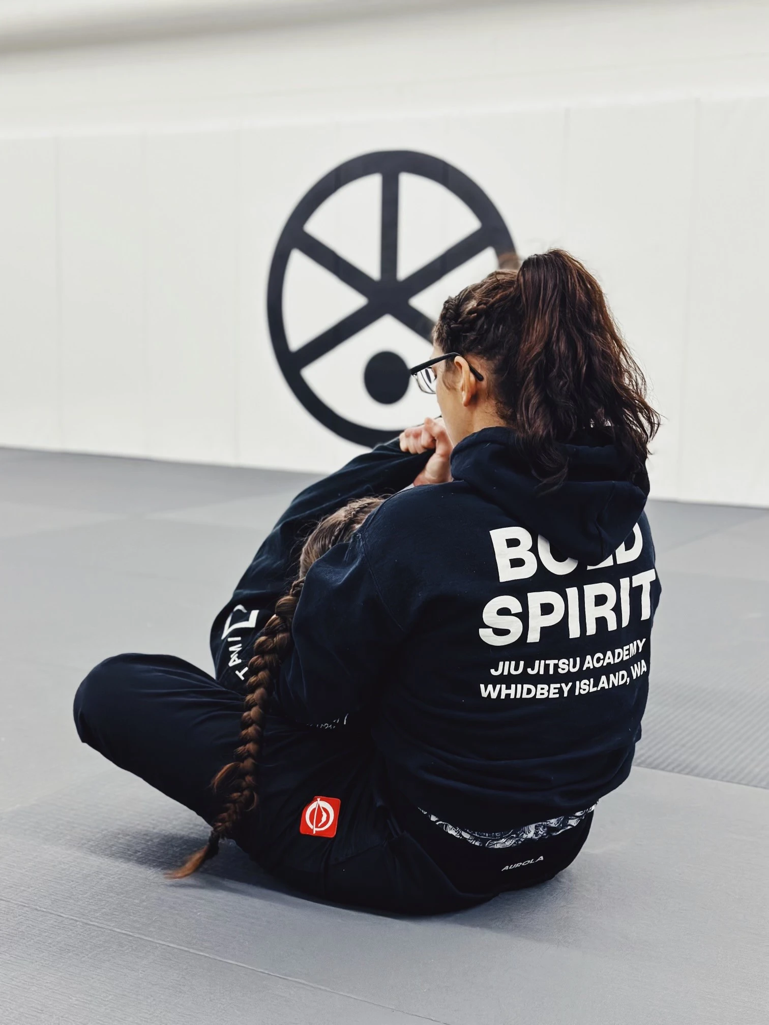 Grapplers doing martial arts in a gym